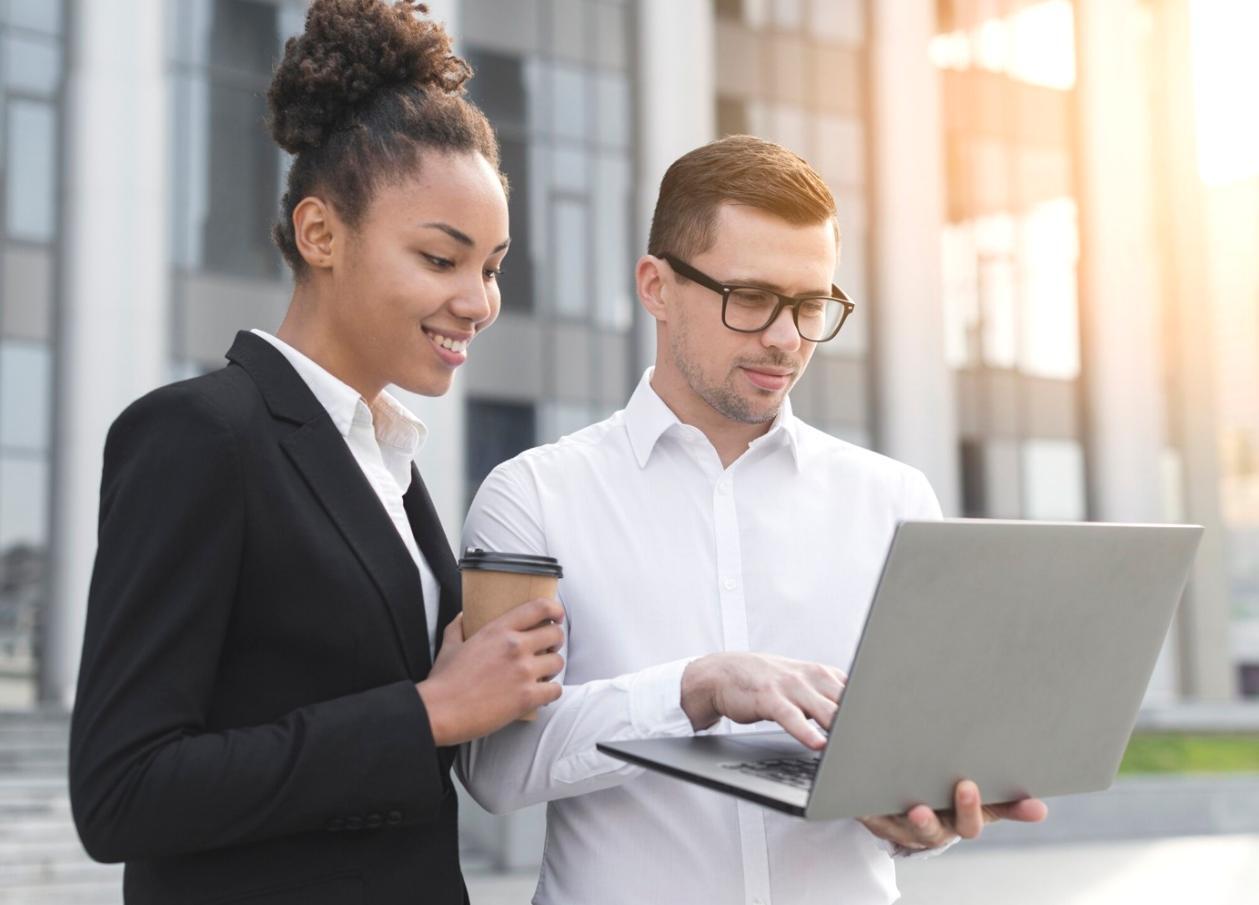 Person reviewing financial documents with determination